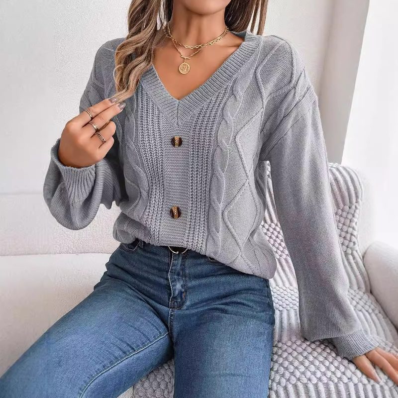 Pull uni en maille torsadée à col V, manches bouffantes et boutonnage